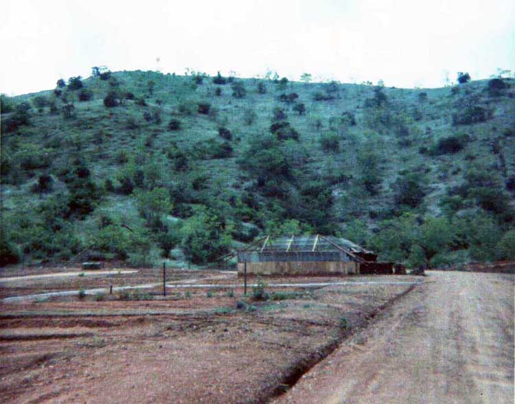 17. Phan Rang Air Base: The First Tent-Hut constructed (graded grounds await future tent-huts). Note: Nui Dat Hill in background does not have a road in early 1966.