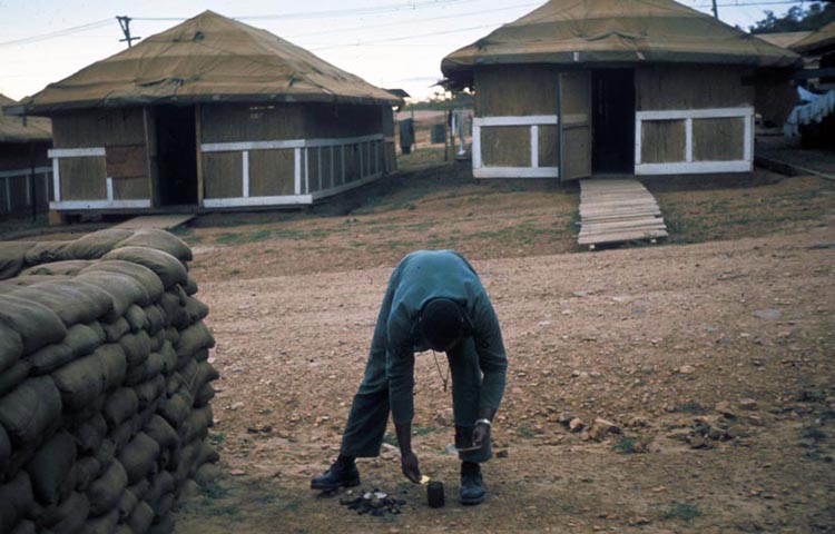 26. Phan Rang Air Base: Who is he, and what's he doing... up to something... cooking C-Rats?