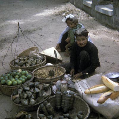 71. Market Place, Granny and kids selling fruit.