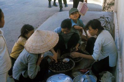 70. Market Place, ladies haggling over fruit.