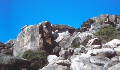 73. Phan Rang: Buddhist homes. Note house with boulder roof (center/top). 