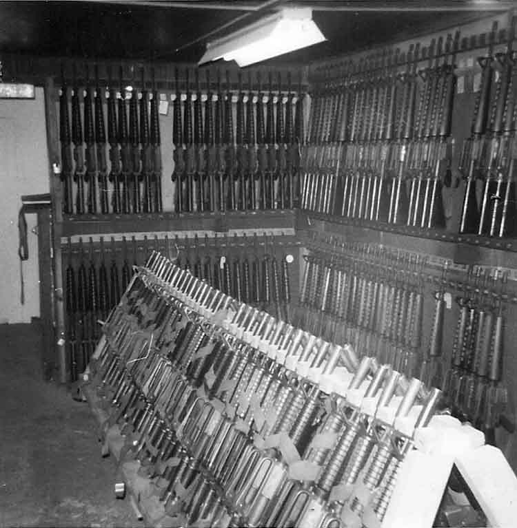 21. Phan Rang Air Base: Law and Security Weapons Room, M-16's Weapons Racks. Photo by: Van Digby, 1968.