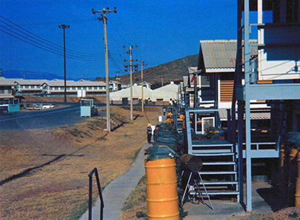 46. Phan Rang AB: Barracks, Vietnamese workers, BBQ stoves, access post, and sandbags.