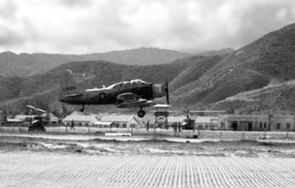 1. Qui Nhơn AB, flight line Tower can be seen beneath the A1E Spad's propeller. Photo by: unknown.