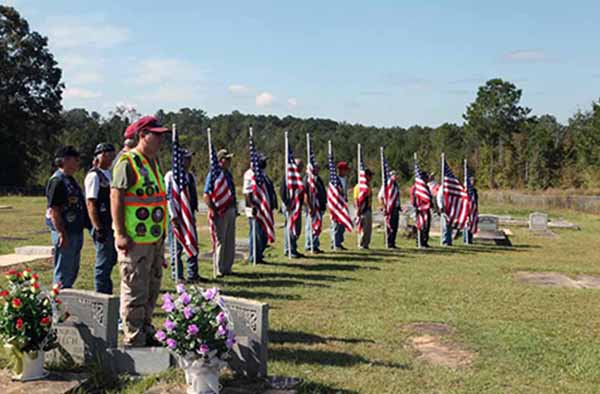 (24) The Patriot Guard Riders at attention.