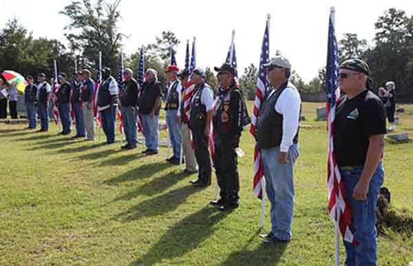 (25) The Patriot Guard Riders at attention.