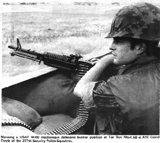 12. Tan Son Nhut Air Base: Manning a USAF M-60 machinegun defensive bunker position at Tan Son Nhut AB, is A1C David Doyle [deceased] of the 377th Security Police Squadron. Photo by: Morris (?) 1972-1973.