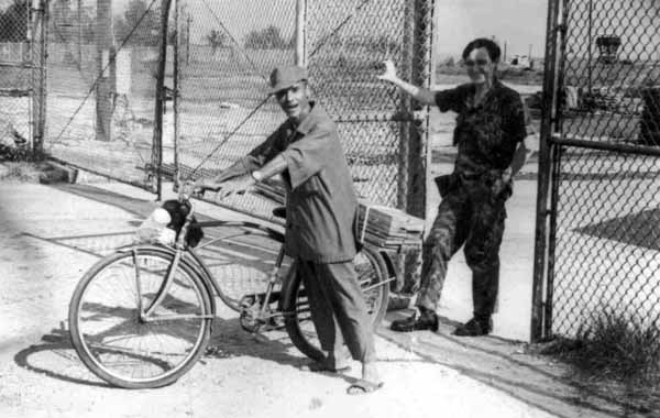 1. Tan My, Loran Station. Airman Bill Ashworth letting papasan out the TMY Main Gate. 1972. Note tower at upper-right. Photo by: Mike Thomas.