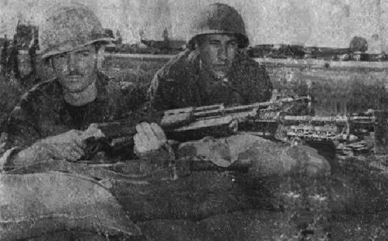 A2C Robert B. Kane and A2C Alvin C. Curie defend their post during the sapper attack of 4 Dec 1966.