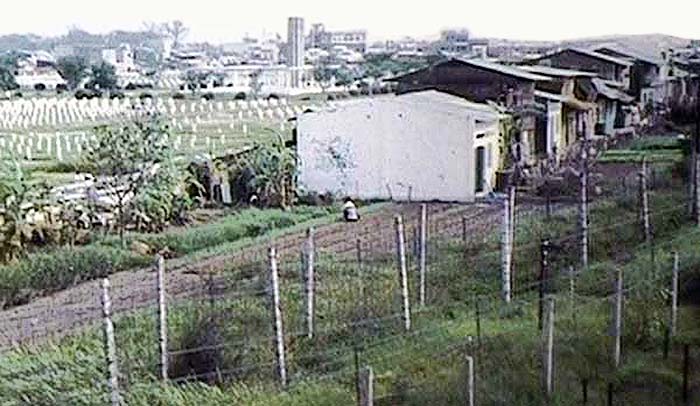 2. The barbed wire fencing you see is the perimeter's mine field. You can see a portion of the French cemetery in the rear of the photograph. Photo by Charles Templeton. 1968.