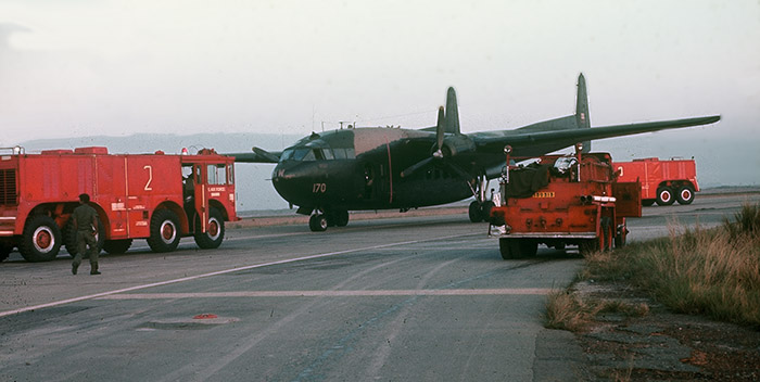 8. TSN Air Base: Crash Crews surround C-118 Spooky inflight-emergency after landing safely.