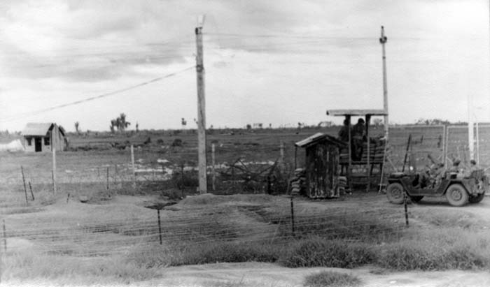 8a. Tan Son Nhut AB, O-51 Gate and Jeep. Photo by: James A. Stewart, LM 60, TSN, 377th SPS K9. 1967-1968.