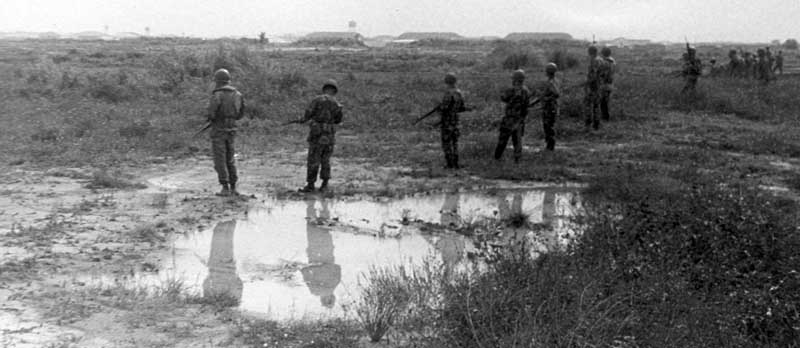 2. Close up: Photo above: 377th Security Police form a scrmish line to search for hiding sappers. 600th Photo Squadron, Vietnam.