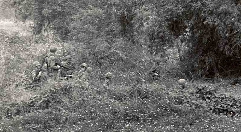 9. Close up below: 377th APS Airmen search perimeter fields, scrub brush, heavy foialage and forest for concealed VC and NVA sappers. 600th Photo Squadron, Vietnam.