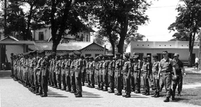 1. USAF-Nungs Security Force, 1st Lt. James Duncan, 6250th Air Police Sqdn., inspecting the Nung Guards. Photo by Kailey Wong, 1967-1968.