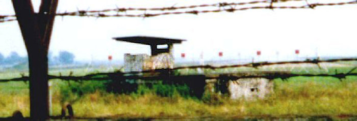 10. Decades later, a revisiting ex-Security Police 'tourist' pestered his tour-guide for permission to stand atop their parked vehicle and raise his camera over the fence for a photo of O-51 Bunker, as it appears today. Standbags have long since melted away, but the blood of four KIA SPs and hundreds of VC and NVA remains a part of that battlefield of Tet 1968. Photo by: unknown.