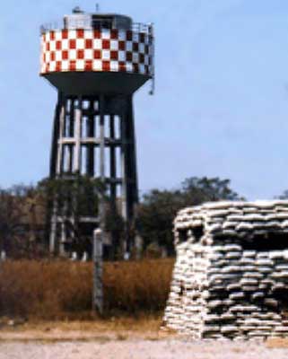377th SPS, Photo: Water Tower, Tango-One, Incoming Rockets spotter atop the water tower. 1967