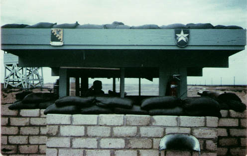 5. Tuy Hoa Air Base: Main Gate, south. Note tower, center-left. Photo by Sgt deWhite. 1969-1970.