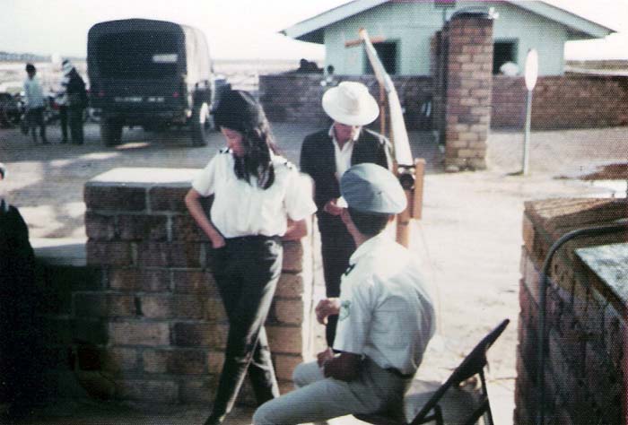 6. Tuy Hoa Air Base: Main Gate, south. ARVN QC checks Vietnamese workers. Photo by Sgt deWhite. 1969-1970.