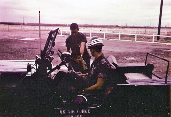 7. Tuy Hoa Air Base: Batman, Vietnamese boy, greets SPs. Photo by Sgt deWhite. 1969-1970.