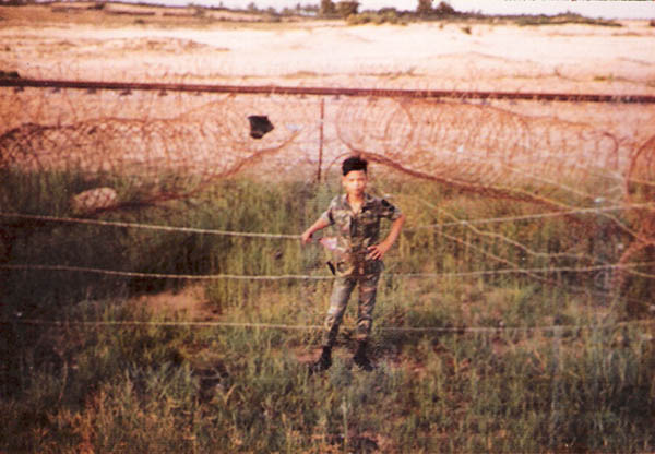 10. Tuy Hoa Air Base: Robin, Batman's sidekick, keeps eye on concertina wire. Photo by Sgt deWhite. 1969-1970.