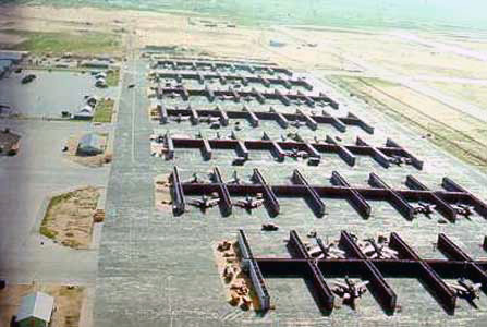 8) The aircraft parking area on the Tuy Hoa flight line with F-100s parked in the revetment areas. This is the area the sappers tried to penetrate during the July 29th attack. But instead they attacked C-130s, probably because they were much larger planes and were on the end of the revetment area so easier to get at.