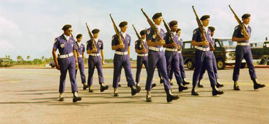 3) 8th SPS Commander's Guard Drill Team, performing on flight line.