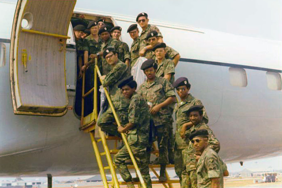5) 8th SPS Commander's Guard Drill Team boarding aircraft (Beret flash can be seen above).