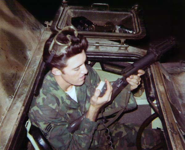 7. Ubon RTAFB. V100, Malcom Calhoun holding M-79 Grenade Launcher and talking on the radio mic. 1969-1970. Photo by: Malcom Calhoun II, UB, 8th SPS; TSN, 377th SPS; TUY, 31st SPS. 1969-1970.