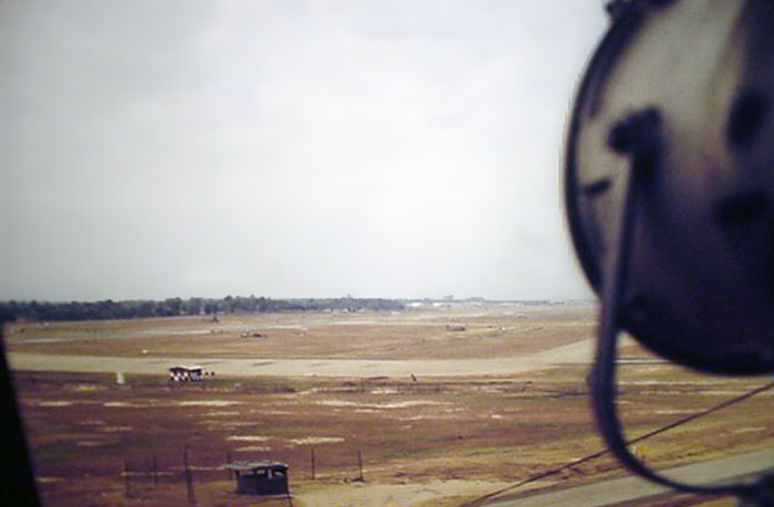 17. Ubon RTAFB. Runway and Taxiway as viewed from Tower, with searchlight. 1970-1971. Photo by: Richard Matott, LM 307, UB, 8th SPS K9. 1973-1974.