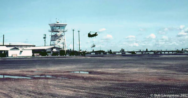 2. Vũng Tàu RTAFB, Control Tower. Note Skycrane carrying a Huey. Photo by: Bob Livingstone. submitted by Bill Kernoczy. 1970.